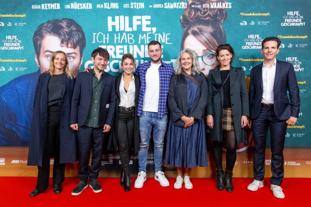 Eventfotografie München, Gruppenfoto auf rotem Teppich während Filmpremiere